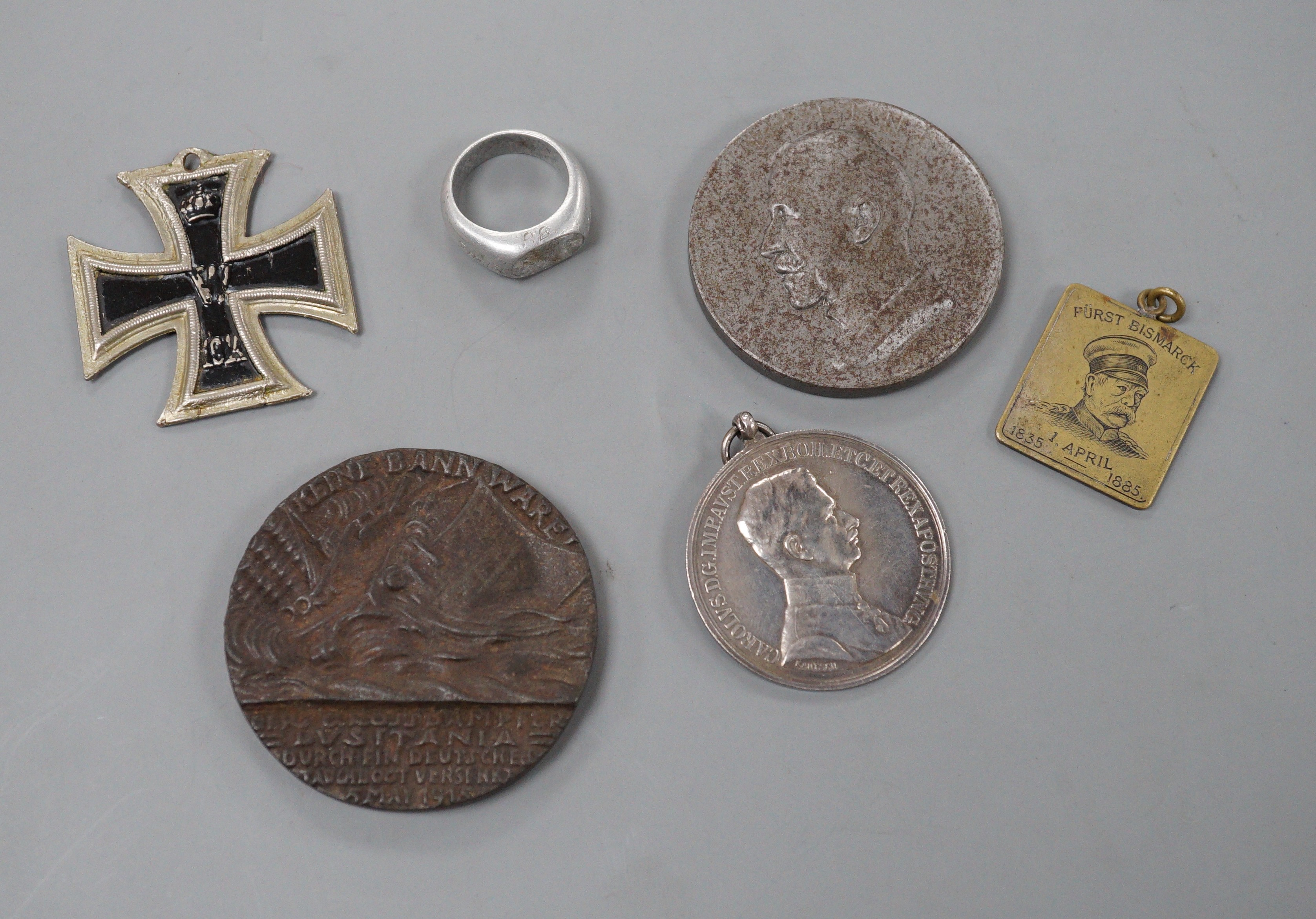 WWI German and Austrian medals, badges and objects, comprising a Zeppelin commemorative aluminium ring, engraved ‘ZEPP L31 OCT. 1916, made from the wreck of Zeppelin LZ31 which was destroyed on the 16th of September 1916